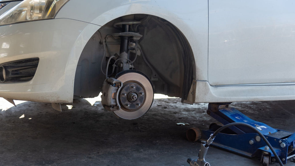 Lifting a Car Safely: Jacks, Bottle Checks, Lifts, Ramps, and Tire Change Precautions