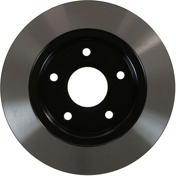 Close-up of the C26483 ProSeries OE+ Brake Rotor, featuring a round, shiny silver finish with a black center and five bolt holes.