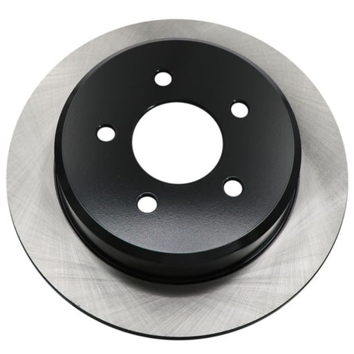A single C25463 ProSeries OE+ brake rotor featuring a black hub and a silver, slotted surface, displayed against a white background.