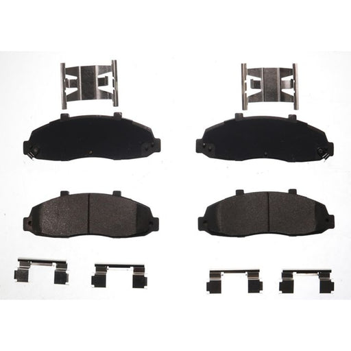 Four BFD679SM ProSeries OE Brake Pads in black, accompanied by metal clips and brackets, arranged on a white background.