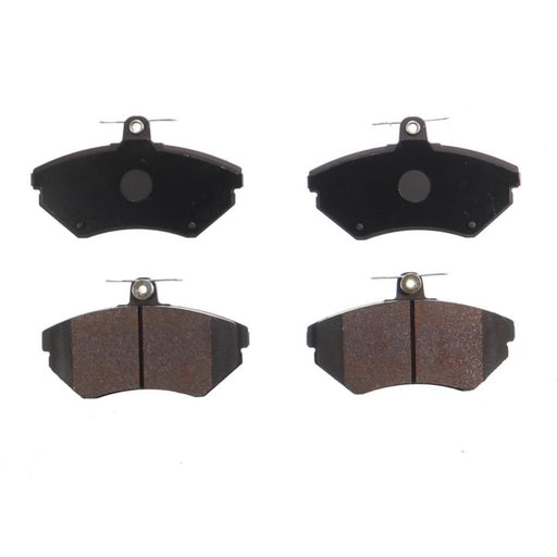Four BFD704SM ProSeries OE Brake Pads, two with a solid black surface and two with a brown friction material surface, arranged in pairs.