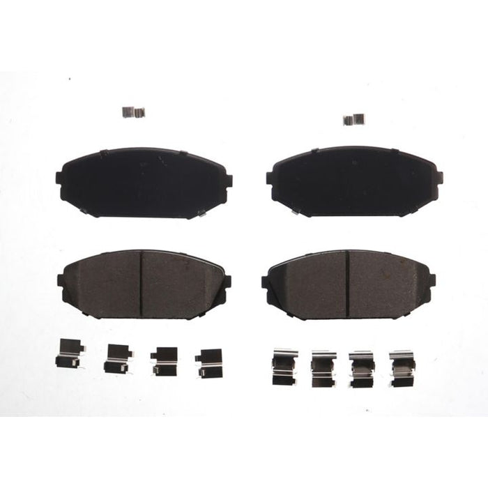 Top-down view of four BFD793CR ProSeries OE Brake Pads and multiple small metallic clips on a white background.