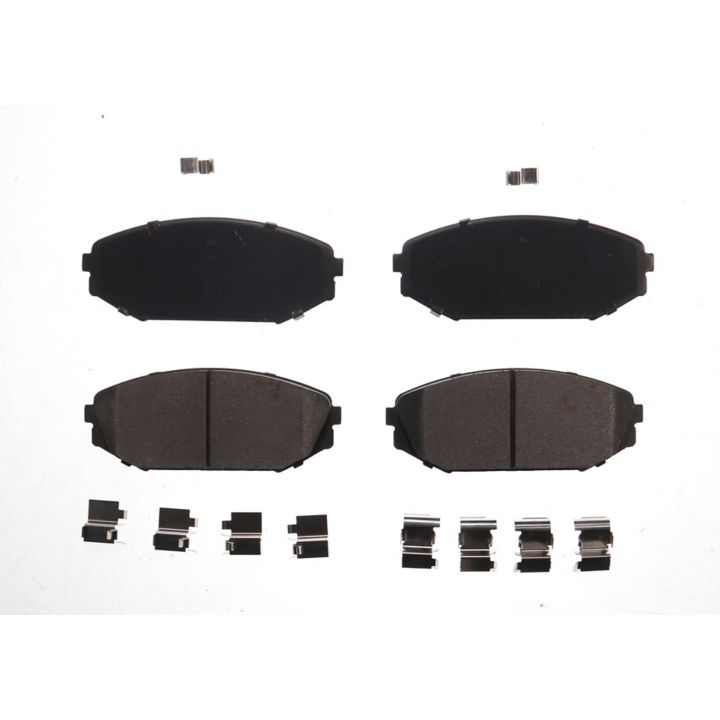 Top-down view of four BFD793CR ProSeries OE Brake Pads and multiple small metallic clips on a white background.