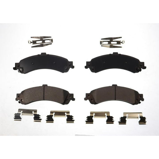 Four BFD975CR ProSeries OE Brake Pads with accompanying clips arranged on a white background.