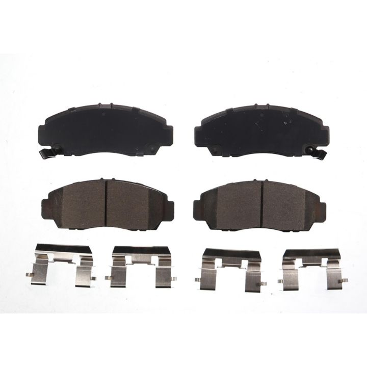 Four BFD787CR ProSeries OE Brake Pads in black, accompanied by four silver hardware clips, are arranged below them on a white background.