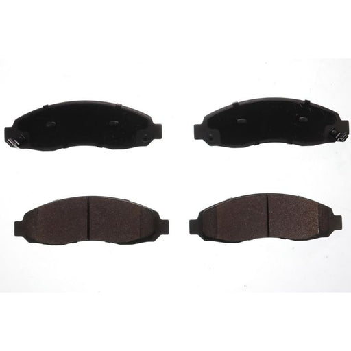 Four BFD962SM ProSeries OE Brake Pads in black, with two showing the friction material upwards (bottom) and two displaying the backing plates upwards (top).