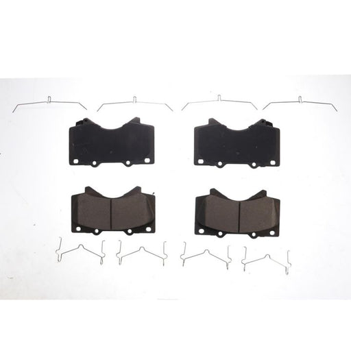 Four BFD1303CR ProSeries OE Brake Pads in black, arranged in two rows with metal clips laid out around them on a plain white background.