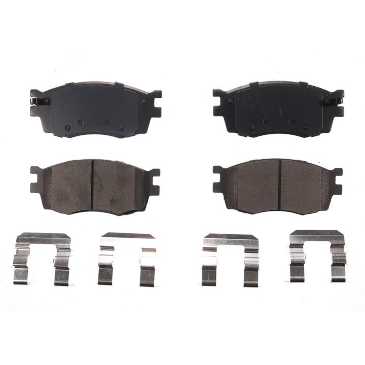 Four BFD1156CR ProSeries OE Brake Pads and four brake pad clips arranged in two rows on a white background.