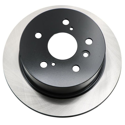 A C26087 ProSeries OE+ Brake Rotor in black and silver, featuring multiple holes, rests on a white background.