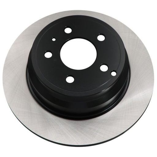 Close-up of the C25440 ProSeries OE+ Brake Rotor, showcasing its circular metal design with holes for wheel attachment.