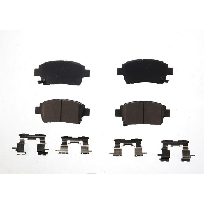 A set of four BFD990SM ProSeries OE Brake Pads with corresponding metal clips arranged on a white background.