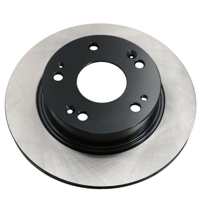 Close-up of the C26082 ProSeries OE+ Brake Rotor, featuring a smooth surface and multiple holes on the black central hub.