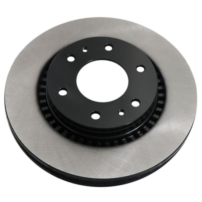 A close-up of the C26446 ProSeries OE+ Brake Rotor in silver and black, featuring drilled holes for mounting.