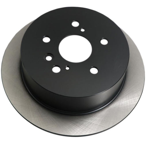 Close-up of a C26186 ProSeries OE+ Brake Rotor featuring a central black hub and multiple holes arranged around the center.