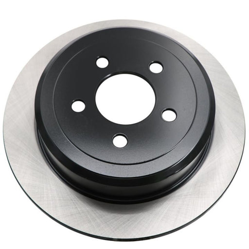 A close-up of the C26472 ProSeries OE+ Brake Rotor, featuring its distinct black and silver design with five holes.