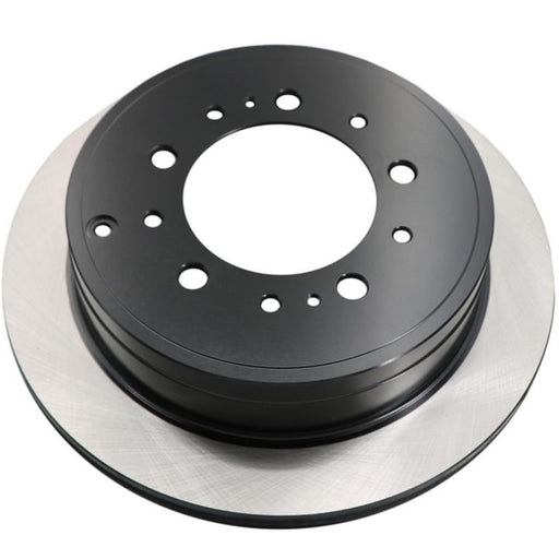 A detailed view of the C26554 ProSeries OE+ Brake Rotor, featuring a black and silver vented design with multiple holes for ventilation and mounting.