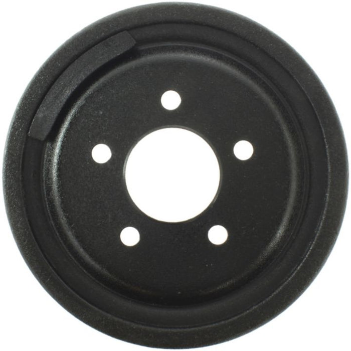 The 8989 Pro-Series OE Brake Drum is a round black disc featuring five small holes arranged in a circle around a larger central hole.