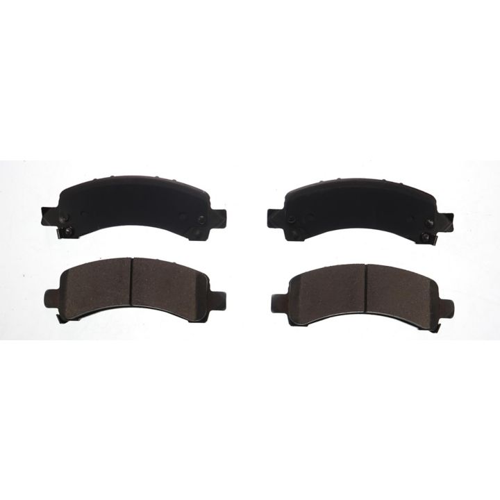 Four BFD974ACR ProSeries OE Brake Pads arranged in two pairs, with each pair showing front and back views.