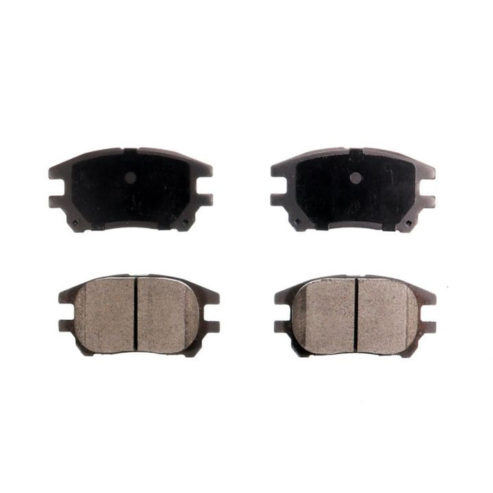 Set of four BFD930CR ProSeries OE Brake Pads, featuring two with friction material visible and two with metallic backing plates facing up.