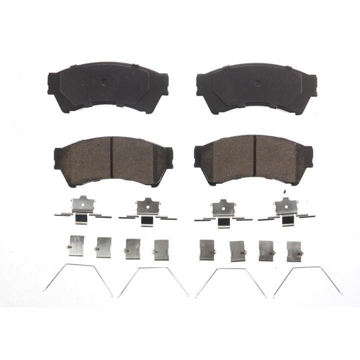 Set of four BFD1164CR ProSeries OE brake pads in black, along with additional metal clips and springs, arranged on a white background.