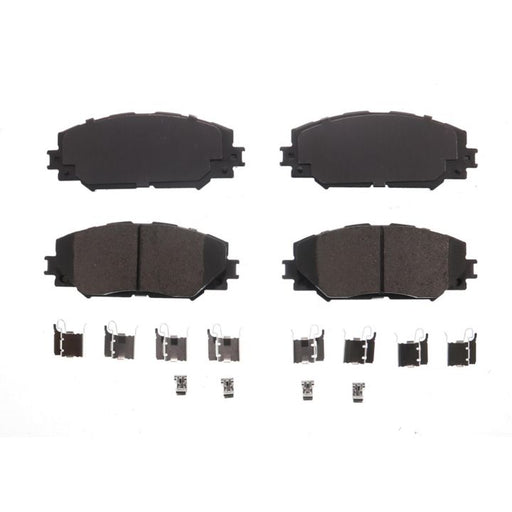 A set of four BFD1210CR ProSeries OE black brake pads with metal clips and hardware arranged below them on a white background.