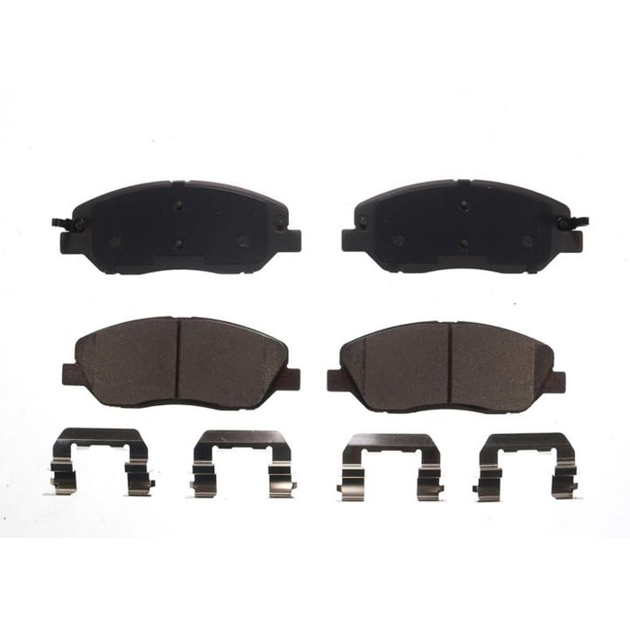 A set of four BFD1202CR ProSeries OE Brake Pads and four metal clips displayed on a white background.