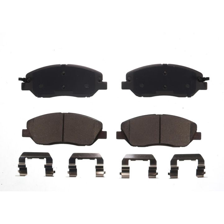 A set of four BFD1202CR ProSeries OE Brake Pads and four metal clips displayed on a white background.