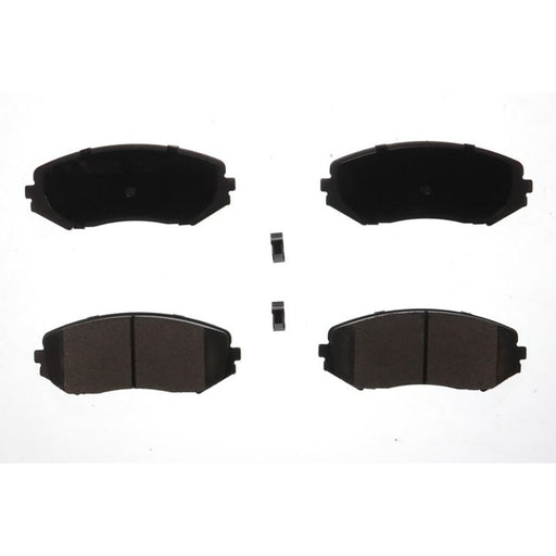 Four BFD1188CR ProSeries OE Brake Pads in black and two small clips on a white background.