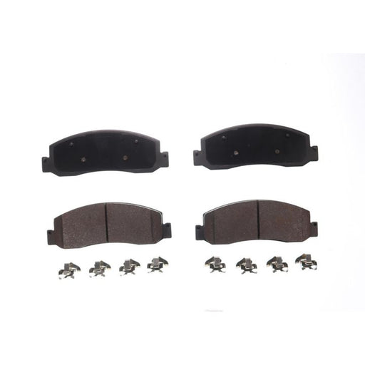 A set of four BFD1333SM ProSeries OE brake pads with accompanying metal clips, displayed on a plain white background.