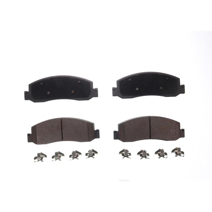A set of four BFD1333SM ProSeries OE brake pads with accompanying metal clips, displayed on a plain white background.