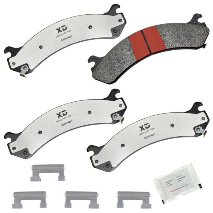 SXD1084 ProSeries XD Brake Pads set includes four silver pads with black edges, four metal clips, and a small packet of grease.