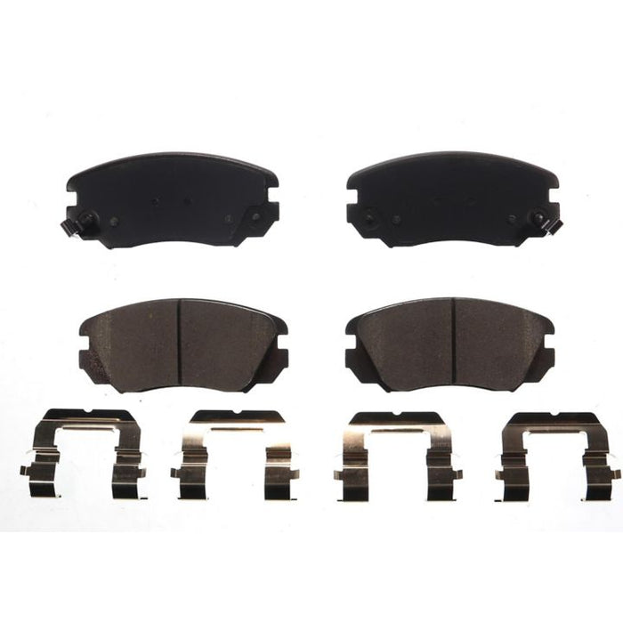 Four BFD1421CR ProSeries OE Brake Pads and four metal clips arranged on a white background.