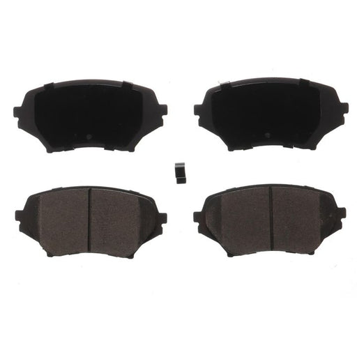 Four BFD1179CR ProSeries OE Brake Pads in black, with a small, black rectangular component placed in the center.