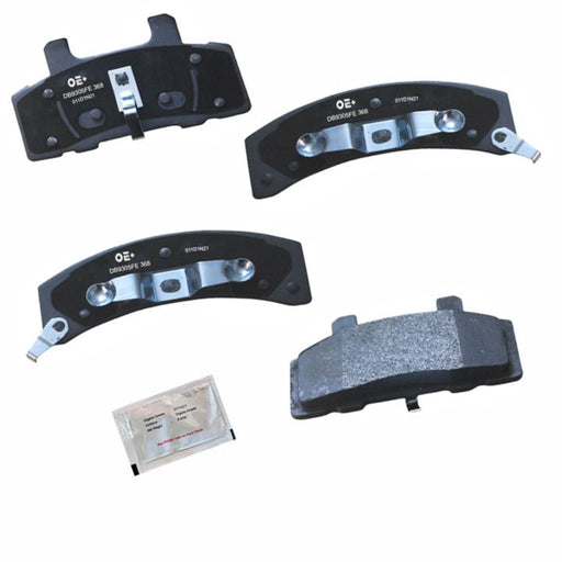 Four MMS368 ProSeries OE+ Brake Pads, which include metal brackets and a small packet with instructions or lubricant.