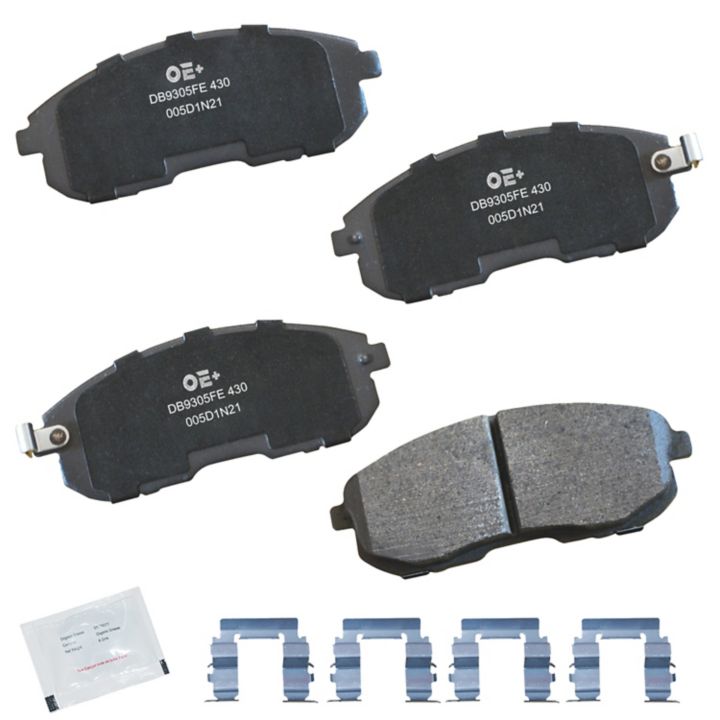 A set of four MMS430 ProSeries OE+ Brake Pads with metallic components and a small installation packet, viewed from various angles.