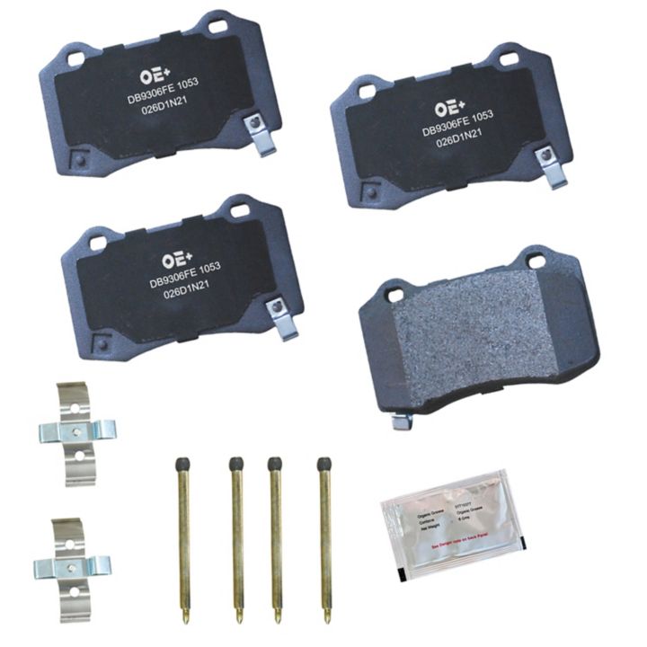 A set of MMS1053 ProSeries OE+ Brake Pads, including four brake pads, four pins, two clips, and a small packet of grease arranged on a white background.