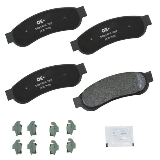 A set of four MMS1067 ProSeries OE+ Brake Pads, eight mounting clips, and a small packet of grease arranged on a white background.
