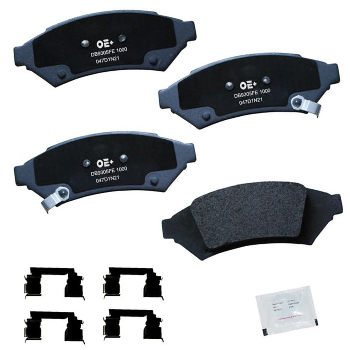 Set of four MMS1000 ProSeries OE+ Brake Pads, four brake pad clips, and a small packet of grease on a white background.