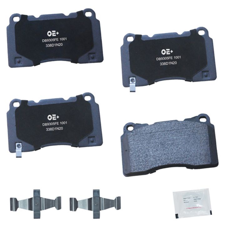 Four MMS1001 ProSeries OE+ Brake Pads, three metal clips, and a small packet are arranged on a plain white background.