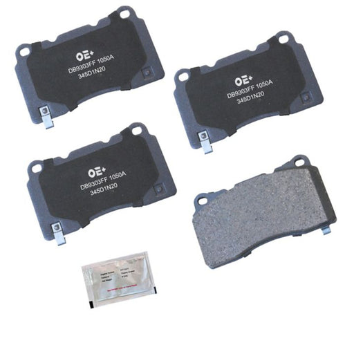 Four MMS1050A ProSeries OE+ Brake Pads and a small packet of brake lubricant arranged on a white background.