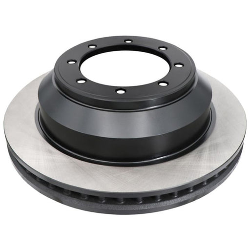 The C26465 ProSeries OE+ Brake Rotor is a shiny, metallic car component with black and silver elements, featuring several holes around the center.