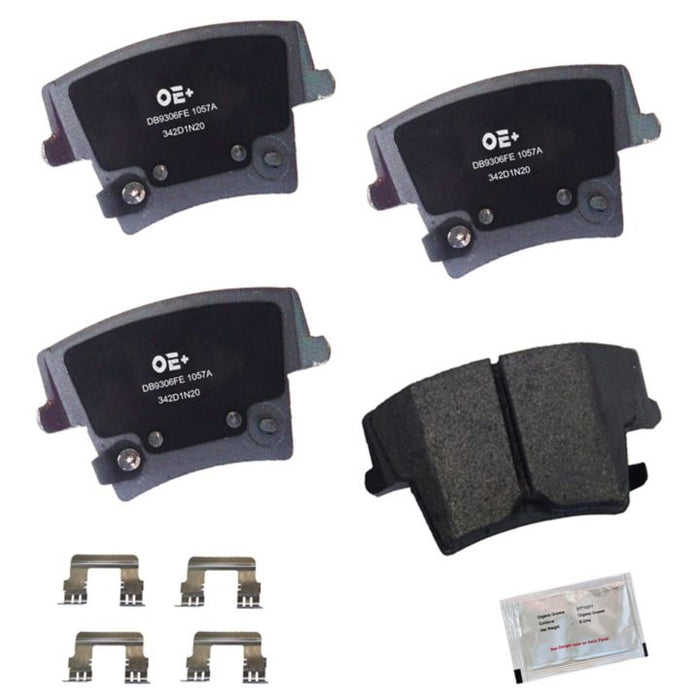 A set of four MMS1057A ProSeries OE+ Brake Pads, complete with metal clips and a packet of lubricant or grease.