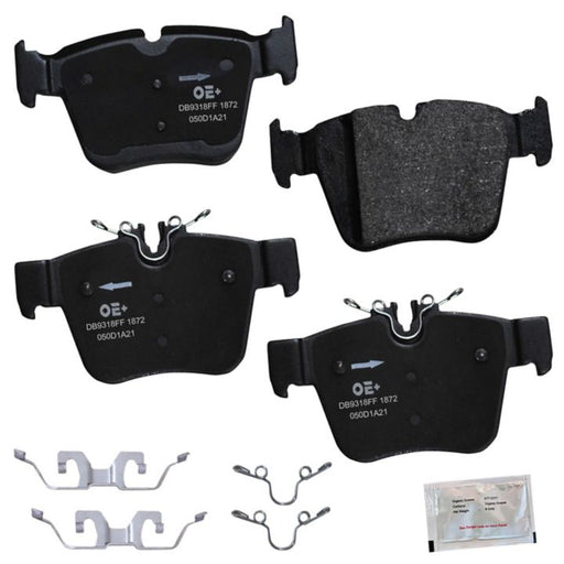 Four MMS1872 ProSeries OE+ Brake Pads, featuring metal clips and accompanied by a small packet of brake lubricant, arranged on a white background.