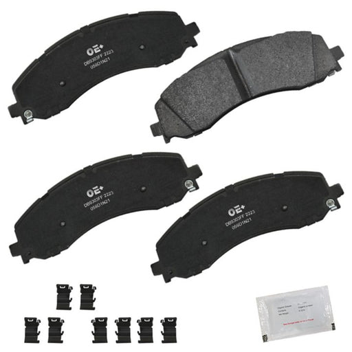 Four MMS2223 ProSeries OE+ Black Brake Pads, with additional small components and a packet of grease for installation.