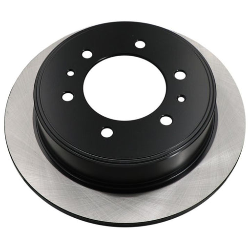 A C26360 ProSeries OE+ Brake Rotor, featuring a black and silver design with a central hole and multiple smaller holes for mounting.