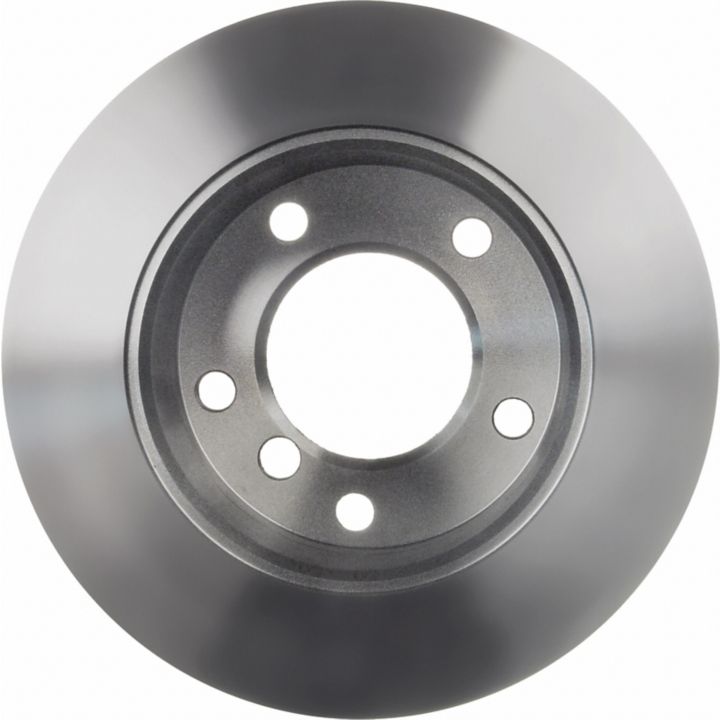 Close-up of a C26279 ProSeries OE+ Brake Rotor, featuring a silver metal finish with a central hole and five smaller surrounding holes.