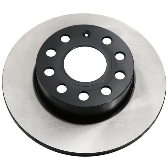 The C80010 ProSeries OE+ Brake Rotor showcases a black, circular center coupled with a silver, shiny outer rim that features multiple drilled holes.