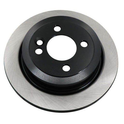 The C80011 ProSeries OE+ Brake Rotor is a round metallic brake disc with multiple holes, featuring a black inner section and a silver outer edge.