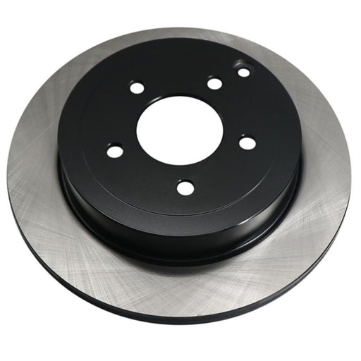 Close-up shot of a shiny, new C08005 ProSeries OE+ Brake Rotor with a black center and silver outer ring.