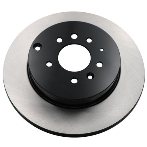 A close-up of the C09040 ProSeries OE+ Brake Rotor showcasing its metallic outer surface and black central hub, featuring multiple holes.